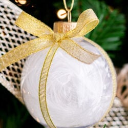 DIY Feather Christmas Ornament hanging. on the tree cover Image