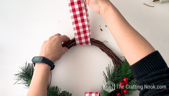 showing a strip of ribbon for the hanger in the Rustic Christmas Wreath