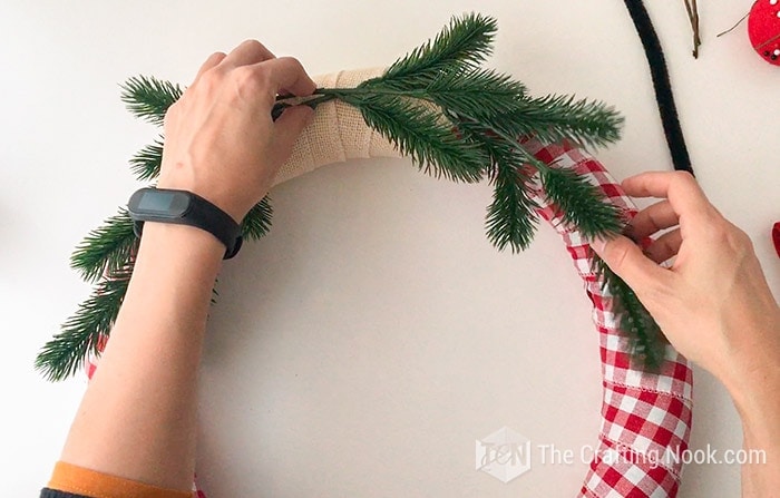  adding the springs to fit the curve on the wreath both sides