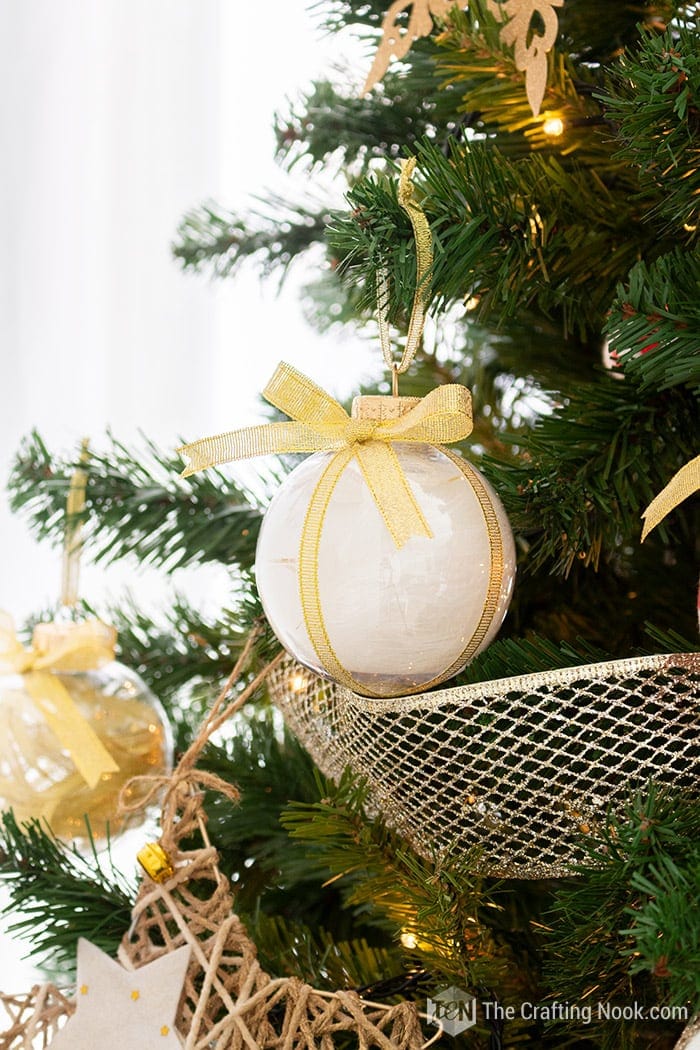 close up of  d clear ornaments with feathers