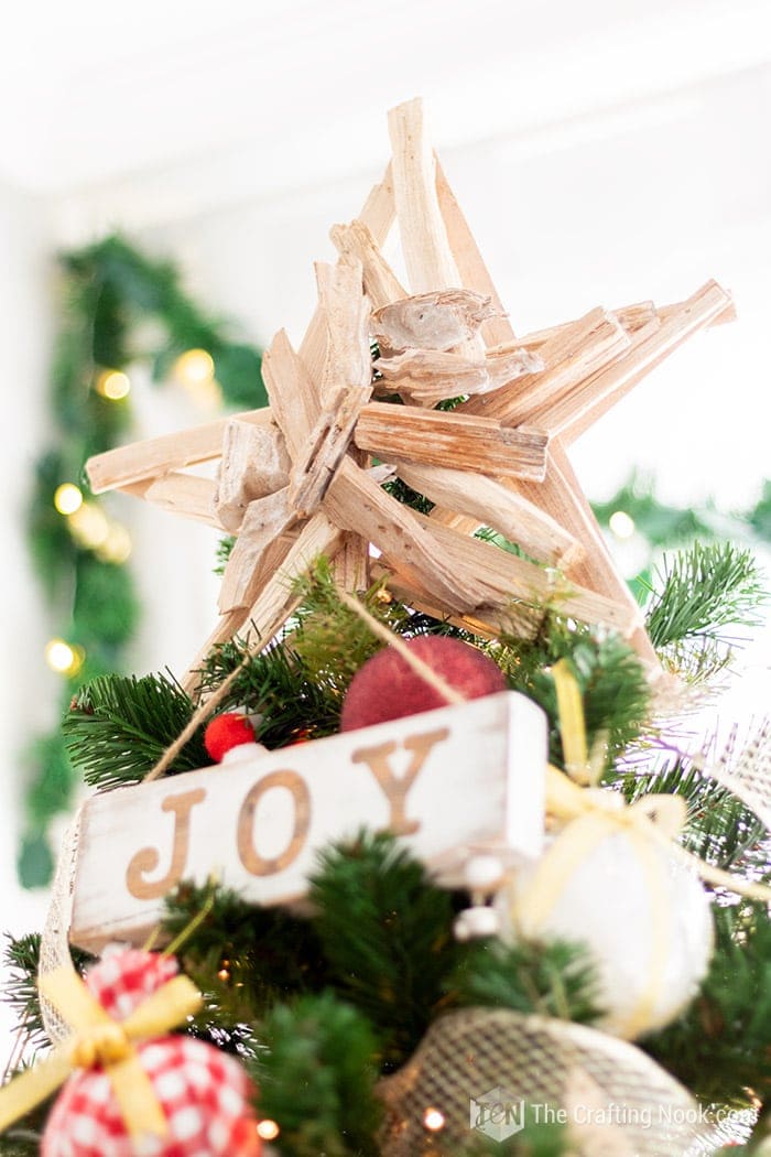 closeup of rustic wooden start in christmas tree