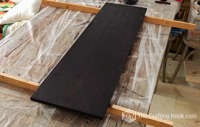 general view of The door board painted in black drying