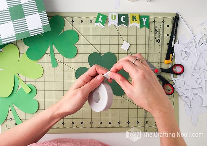 Cutting pieces of double-sided foam tape