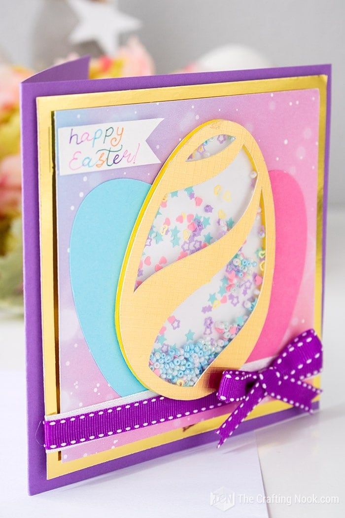 Super cute Easter card with a diy shaker filled with colorful beads and confetti.