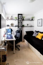 Compact gaming and home office space with a cozy guest bed. Modern decor, functional furniture, and.