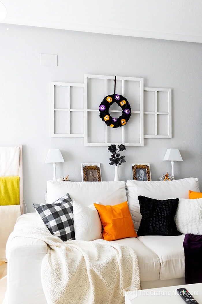 couch with orange and black cushions