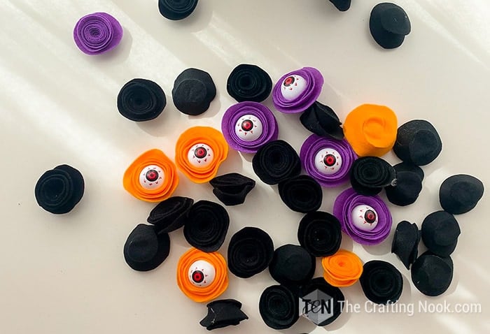 some eyeballs flowers and black felt flowers