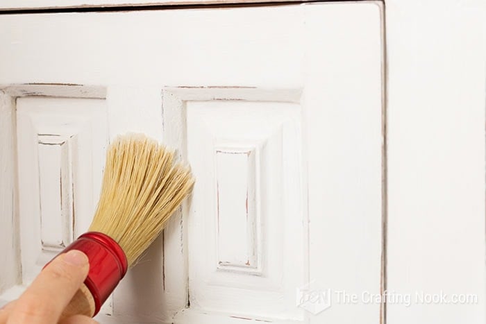 Waxing the Vintage Buffet with a brush after  Chalk paint.