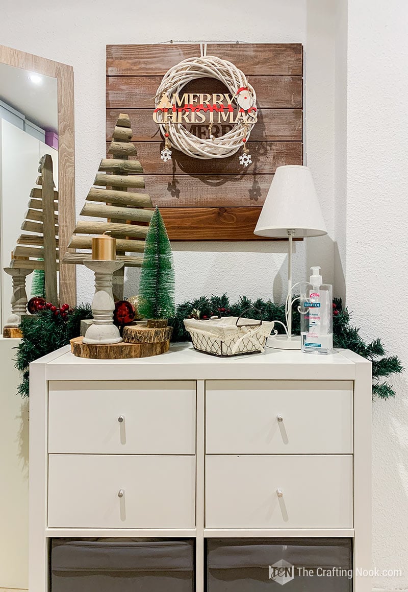 The entryway table decorated for Christmas