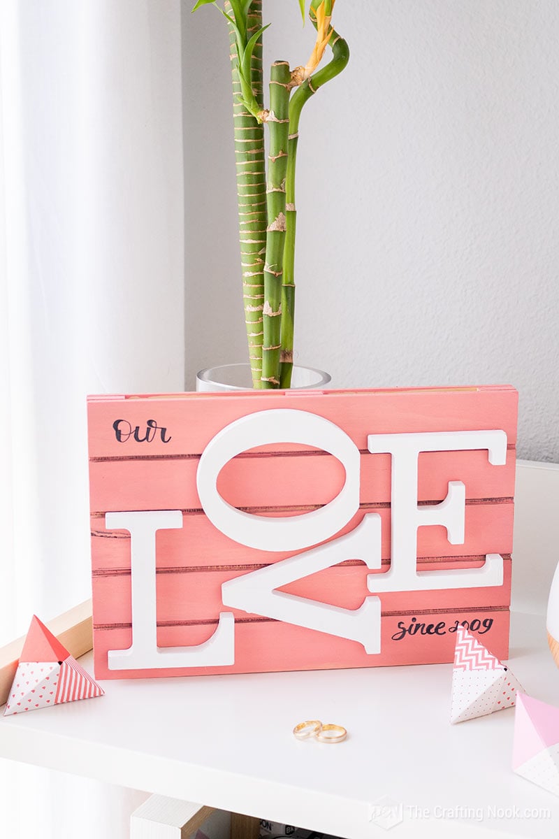 The Mini Pallet wood sign placed on my table with some origami fortune cookies and our wedding rings