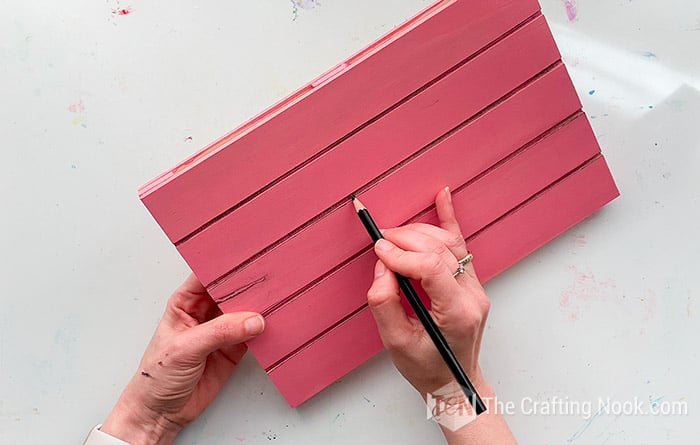 darkening the edges of the pallet creases with a black crayon