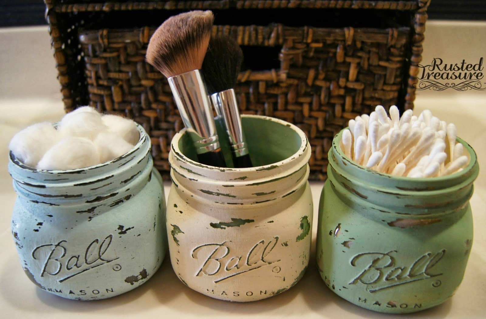 small painted Mason jars to hold little bathroom items like cotton balls, q-tips, and makeup brushes, original site down