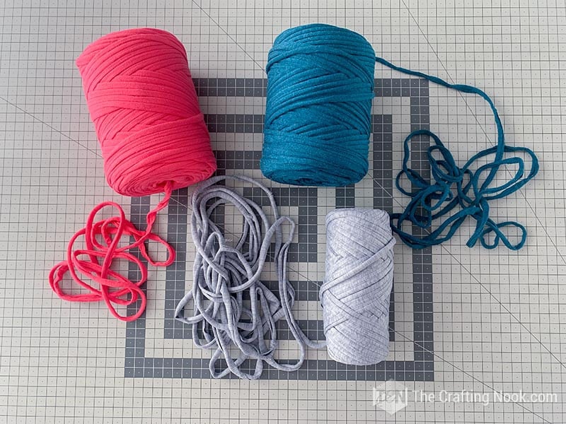 A Pink, Teal and Grey ball of jersey yarn to make Finger Knitted Bracelet