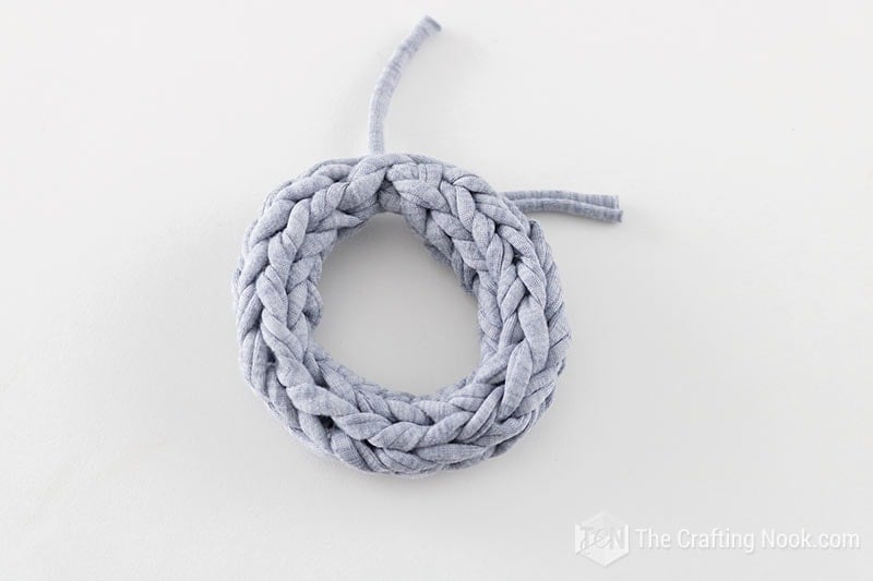 overhead view of the 2 fingers knitted bracelet color grey