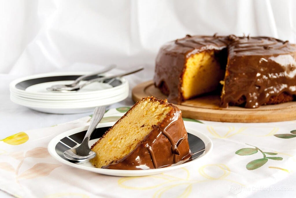 Easy Orange Cake Recipe with Nutella Glaze sliced on a plate