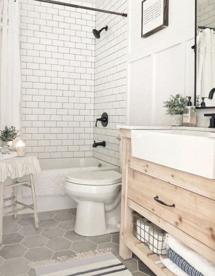 AN APRON SINK IN A SMALL BATHROOM