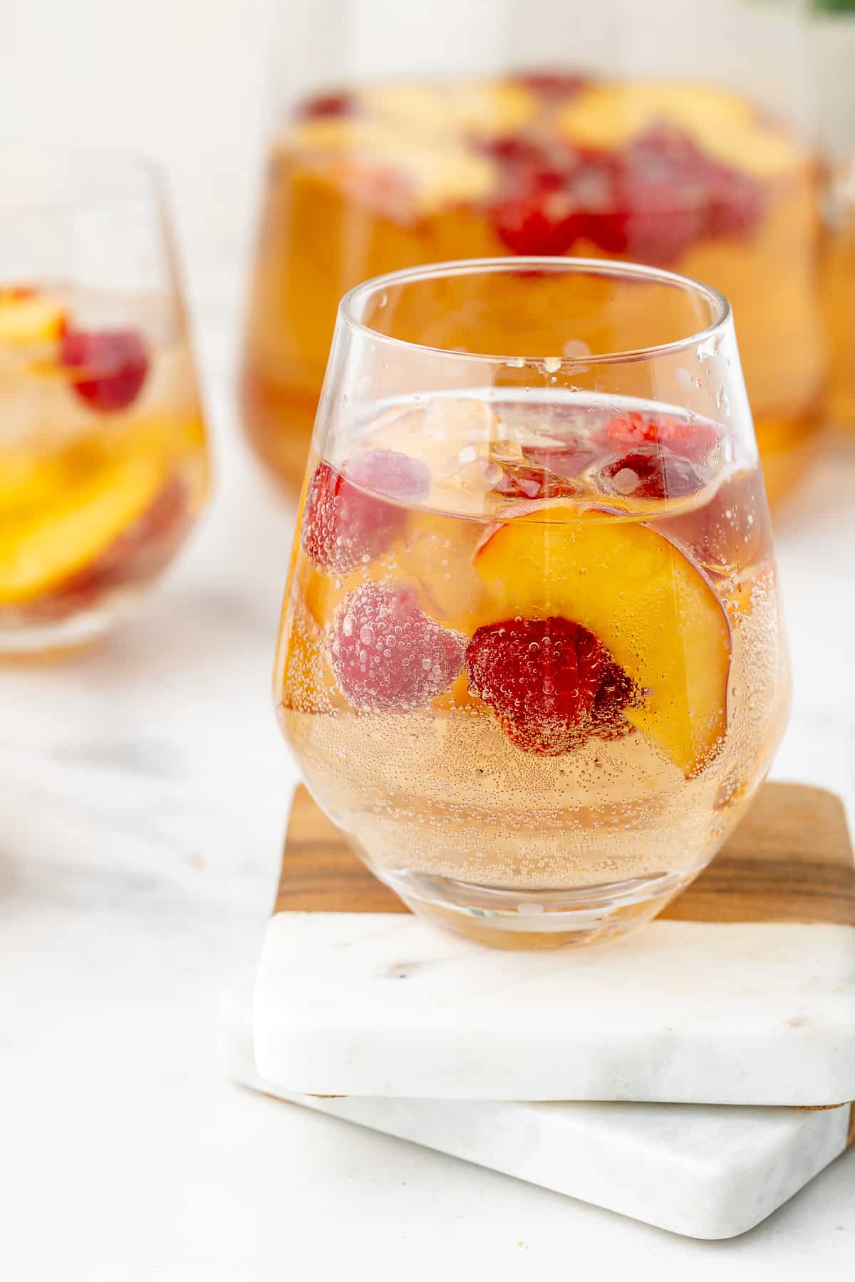 Sparkling rosé peach and raspberry sangria by The Sassy Foodie