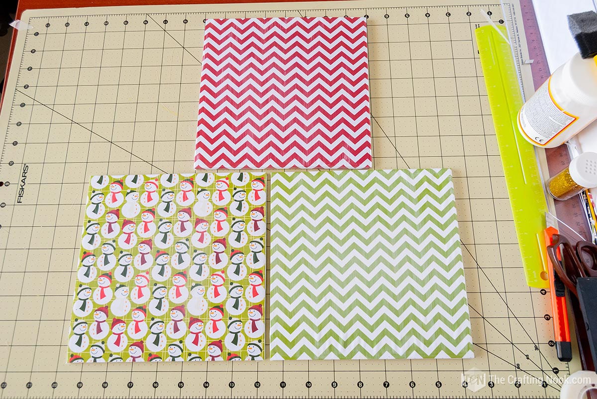 view of 3 Patterned papers drying on cutting mat