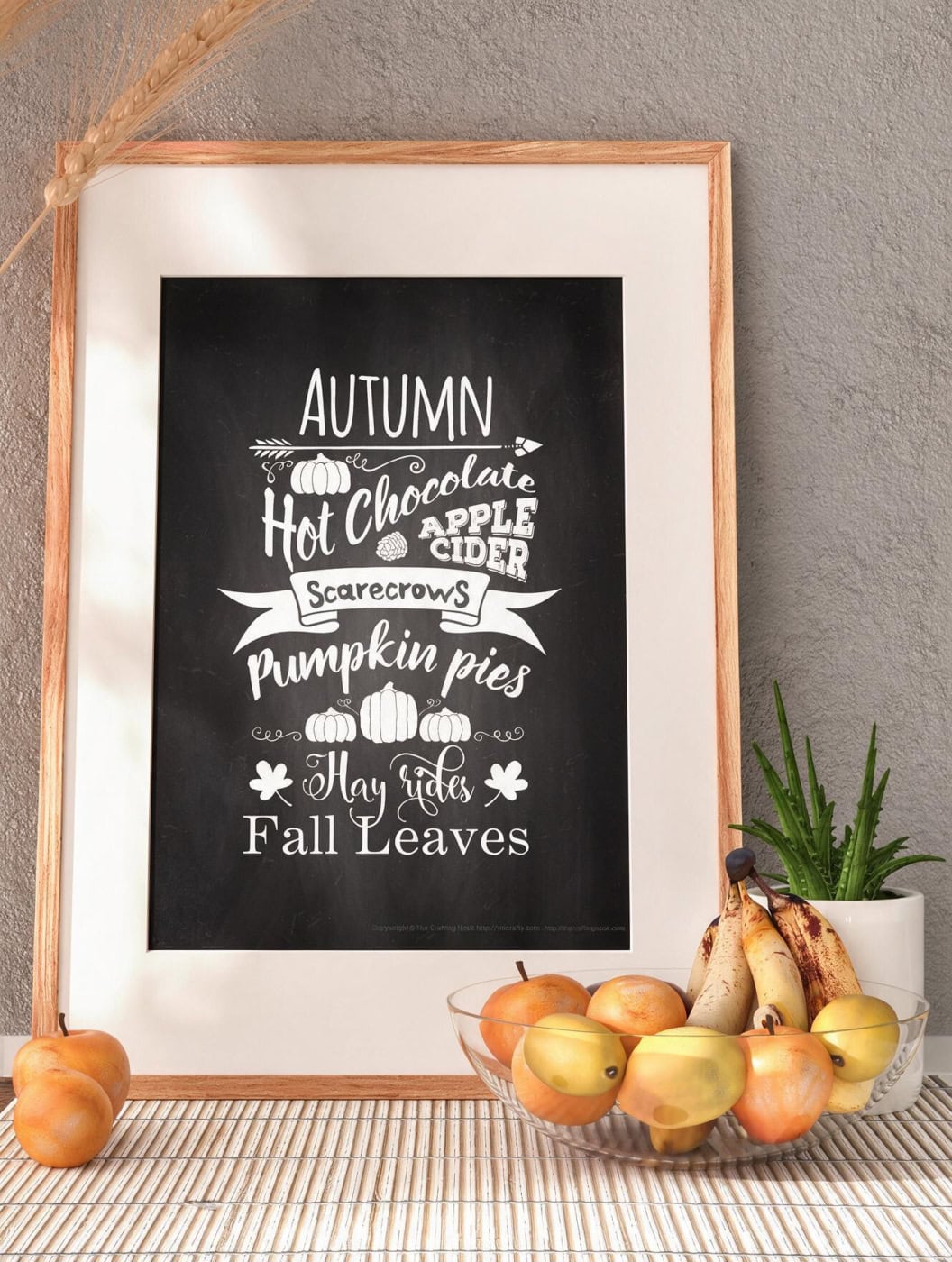 Autumn-themed chalkboard art with fall words and pumpkin illustrations.