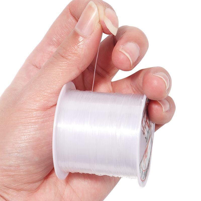 close view holding a spool of nylon thread
