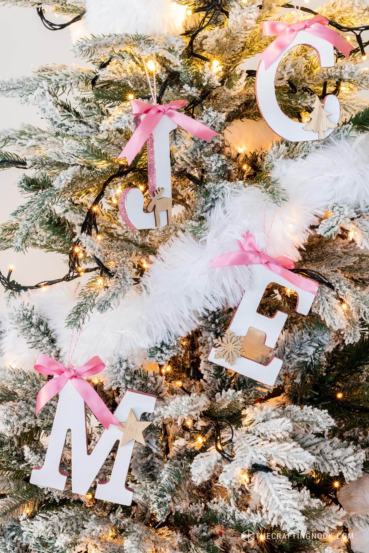 DIY Initial Letter Ornaments with Glitter on the side edges hanging on the tree letter M, C, J and E.