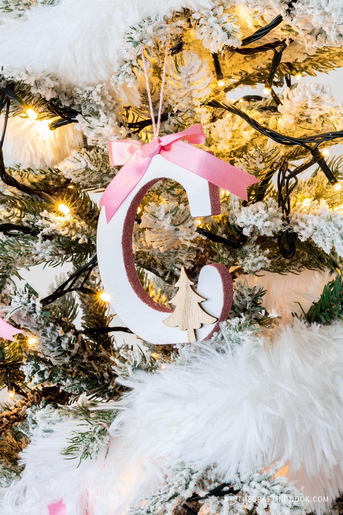 DIY Initial Letter Ornaments with Glitter on the side edges hanging on the tree letter C.