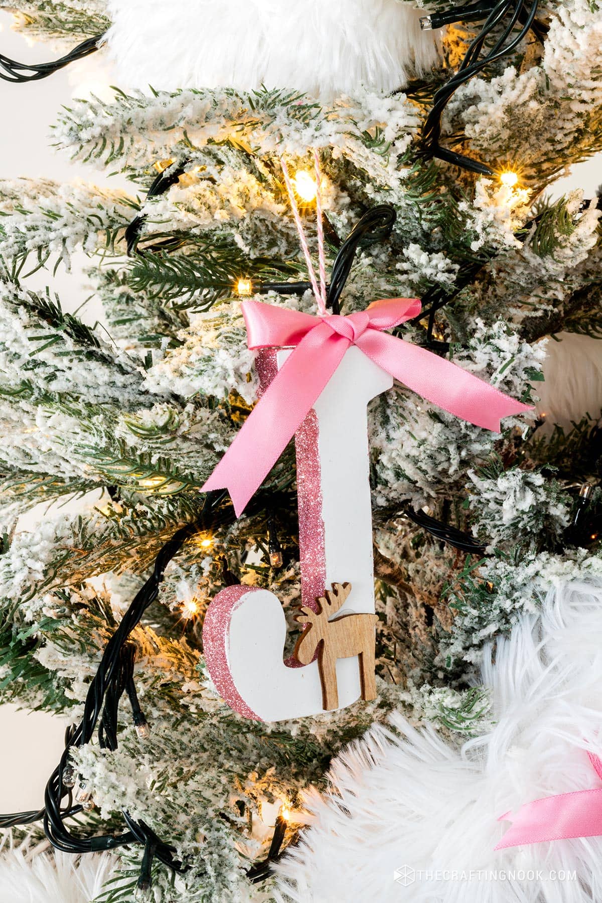 DIY Initial Letter Ornaments with Glitter on the side edges hanging on the tree letter J.