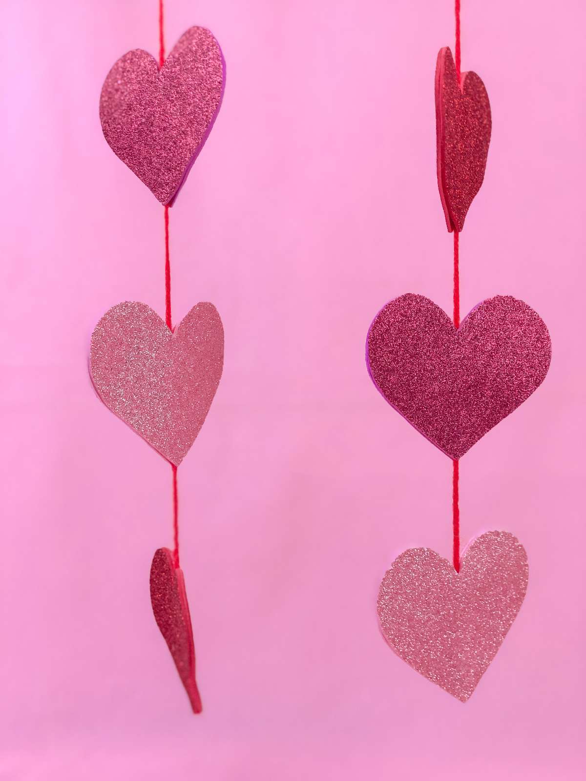 Easy Glitter Heart Garland for Valentines Day by Two Kids and Coupon