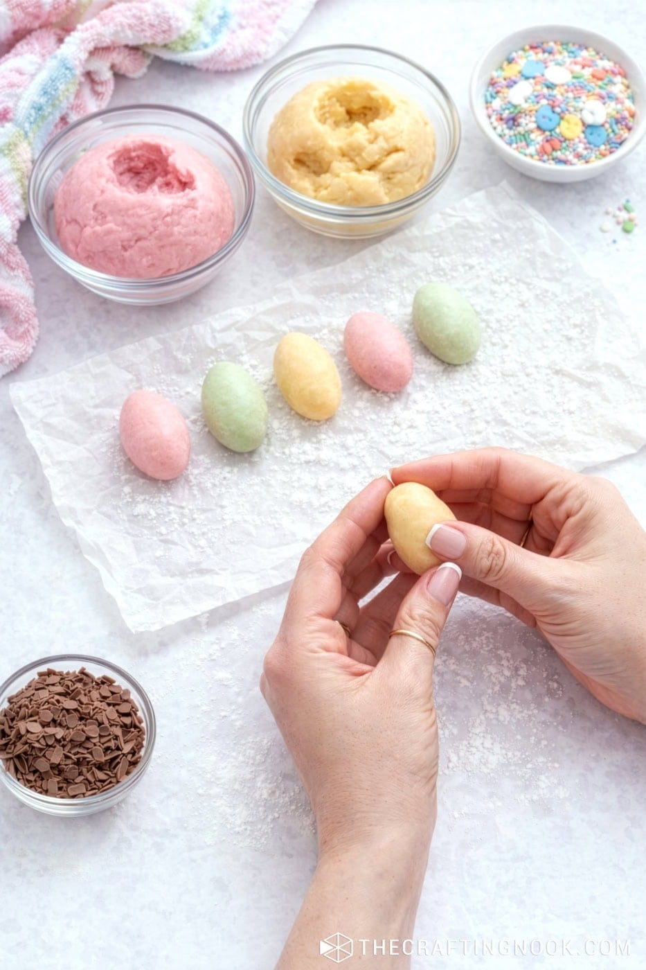 Delicious Venezuelan Papitas de Leche with colorful sprinkles and chocolate shavings aroudn the table.