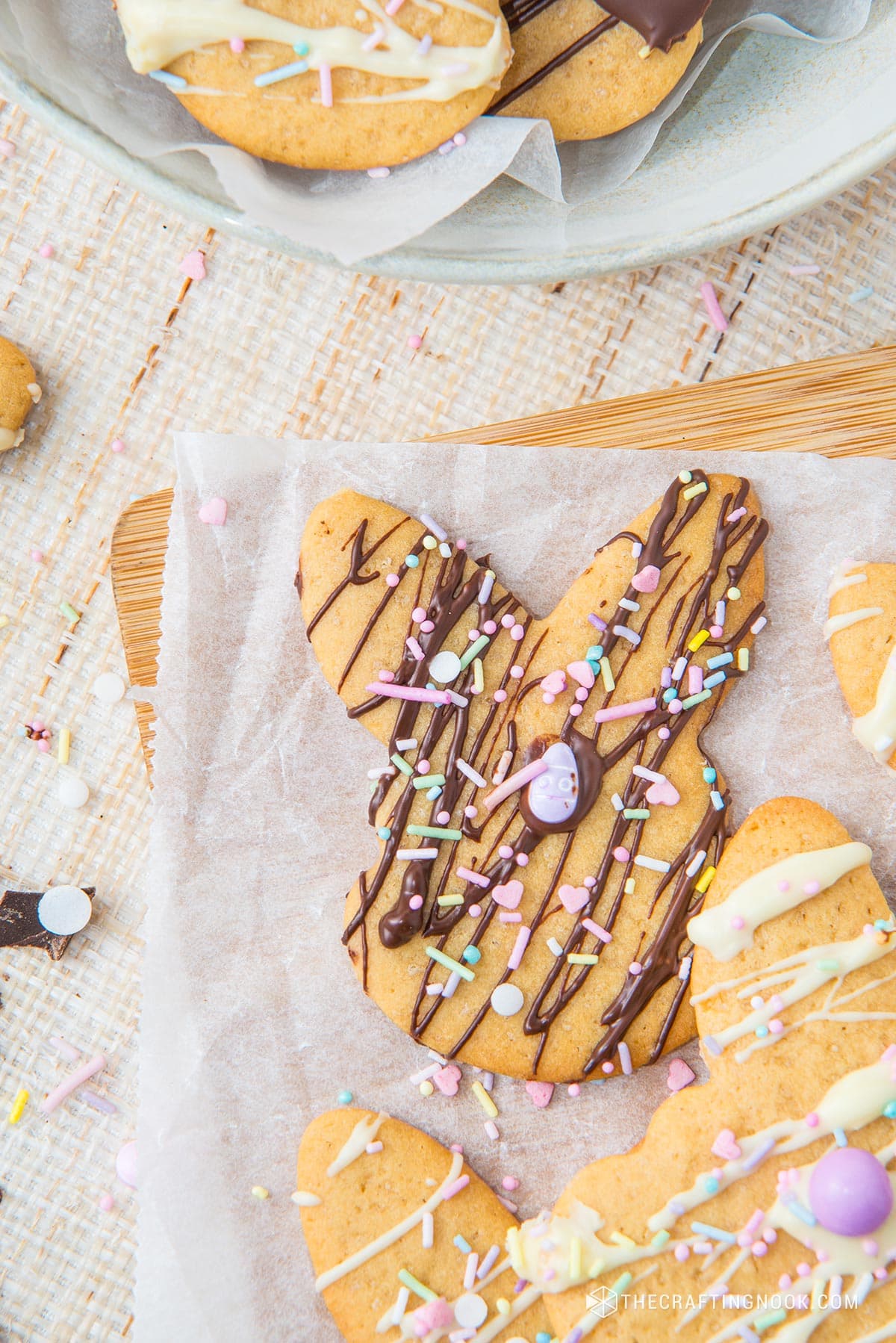 Super closeup of one of the easter bunny sugar cookies drixxle with milk chocolate and spkinkles