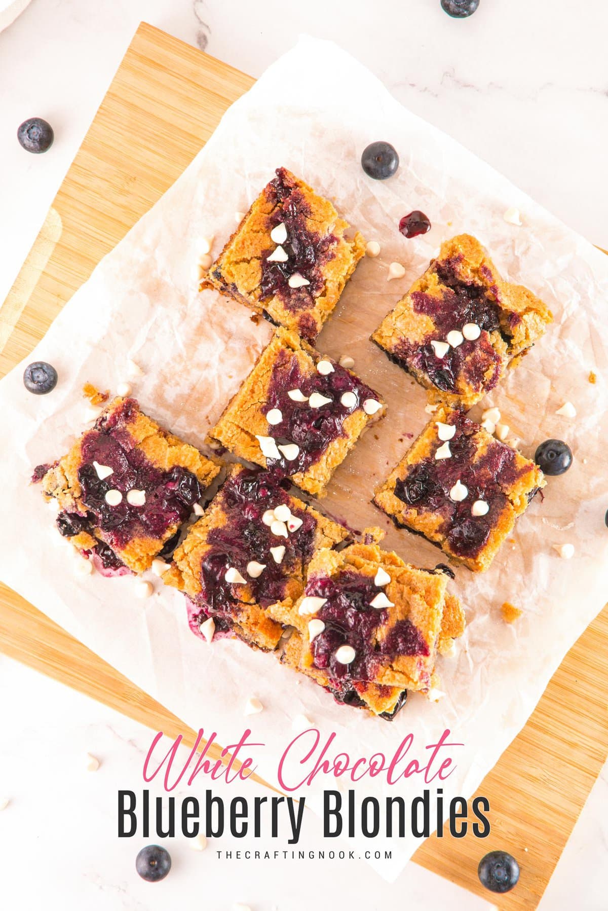 White Chocolate Blueberry Blondies cut in nineths on a piece ofpartchment paper and a cutting board. Cover image with title text overlay