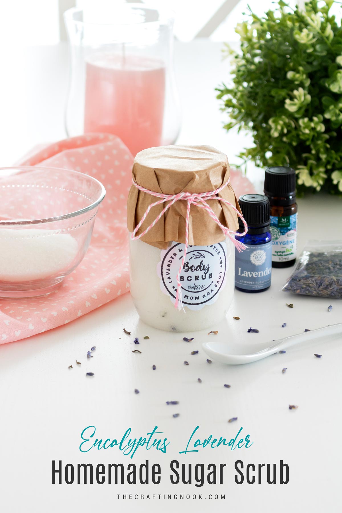 Eucalyptus Lavender Sugar Scrub Recipe beautifuly presented in a har with the lid decorated with craft paper and twine plus a cute label on the jar. Cover image with title text overlay