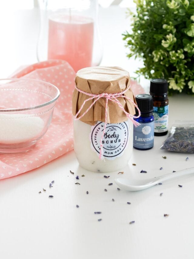 Eucalyptus Lavender Sugar Scrub Recipe beautifuly presented in a har with the lid decorated with craft paper and twine plus a cute label on the jar. Cover image.