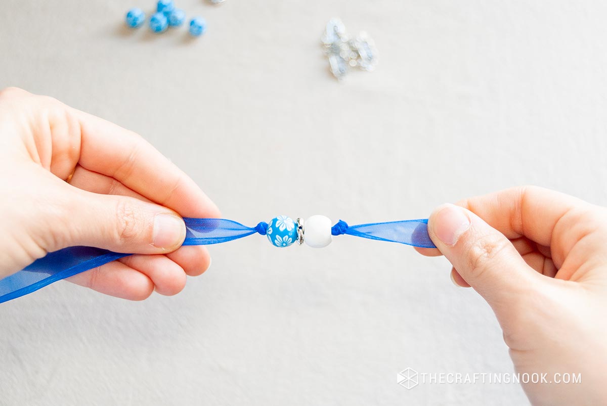 showing the knots made at the ends of the beads
