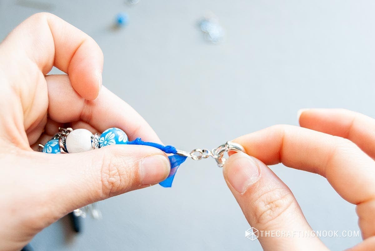 showing the folding crimp end and a clasp piece at one end.
