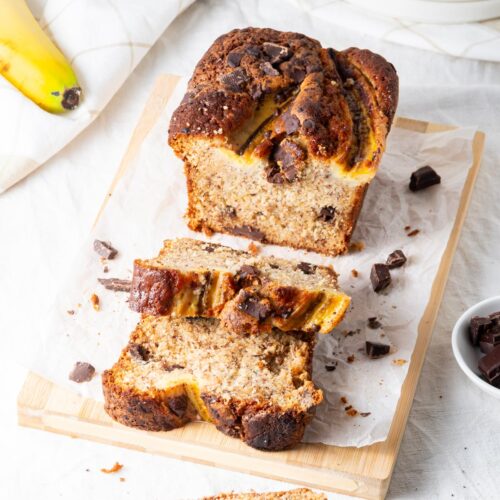 Chocolate Chunk Banana Bread Recipe Without Butter sliced on a chopping board Cover image