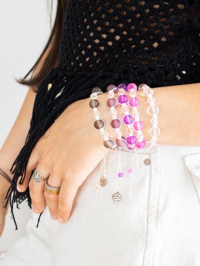 DIY macrame bracelet with beads being weorn on a wrist. Cover image