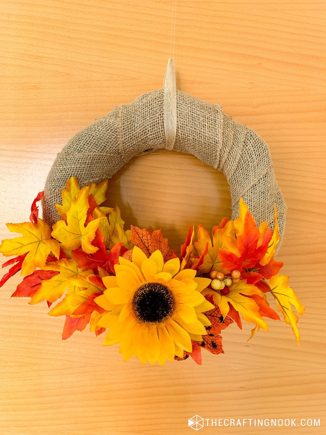 The DIY Burlap Wreath for Fall hanging on our door viewd from upn close