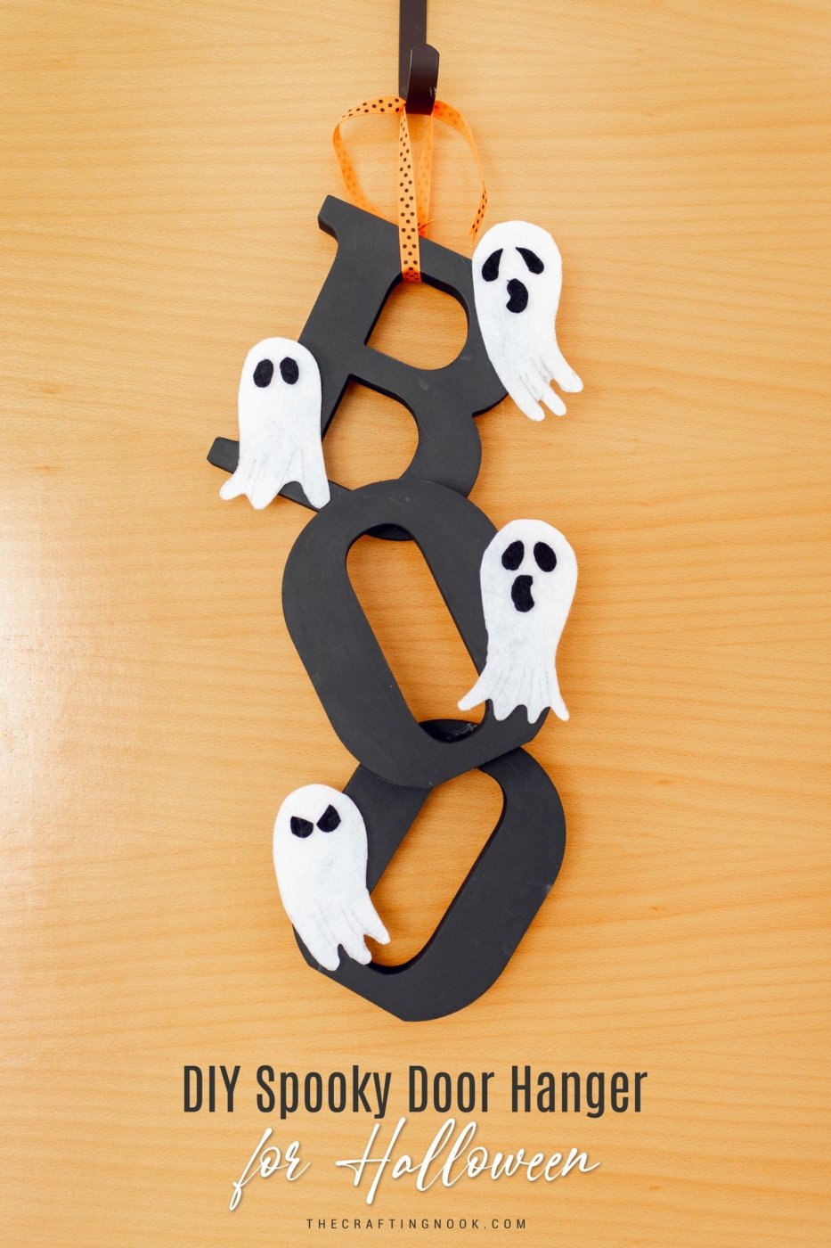 DIY Halloween Door Hanger hanging on the door. Feature image with title text overlay