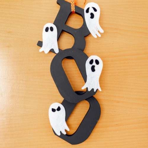 DIY Halloween Door Hanger hanging on the door. Feature image