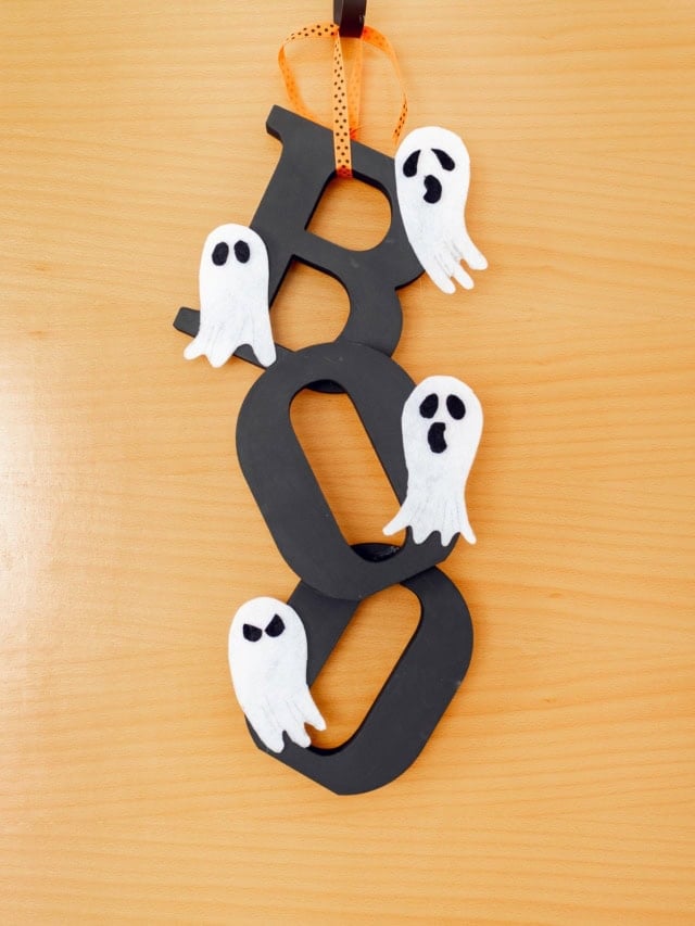 DIY Halloween Door Hanger hanging on the door. Feature image