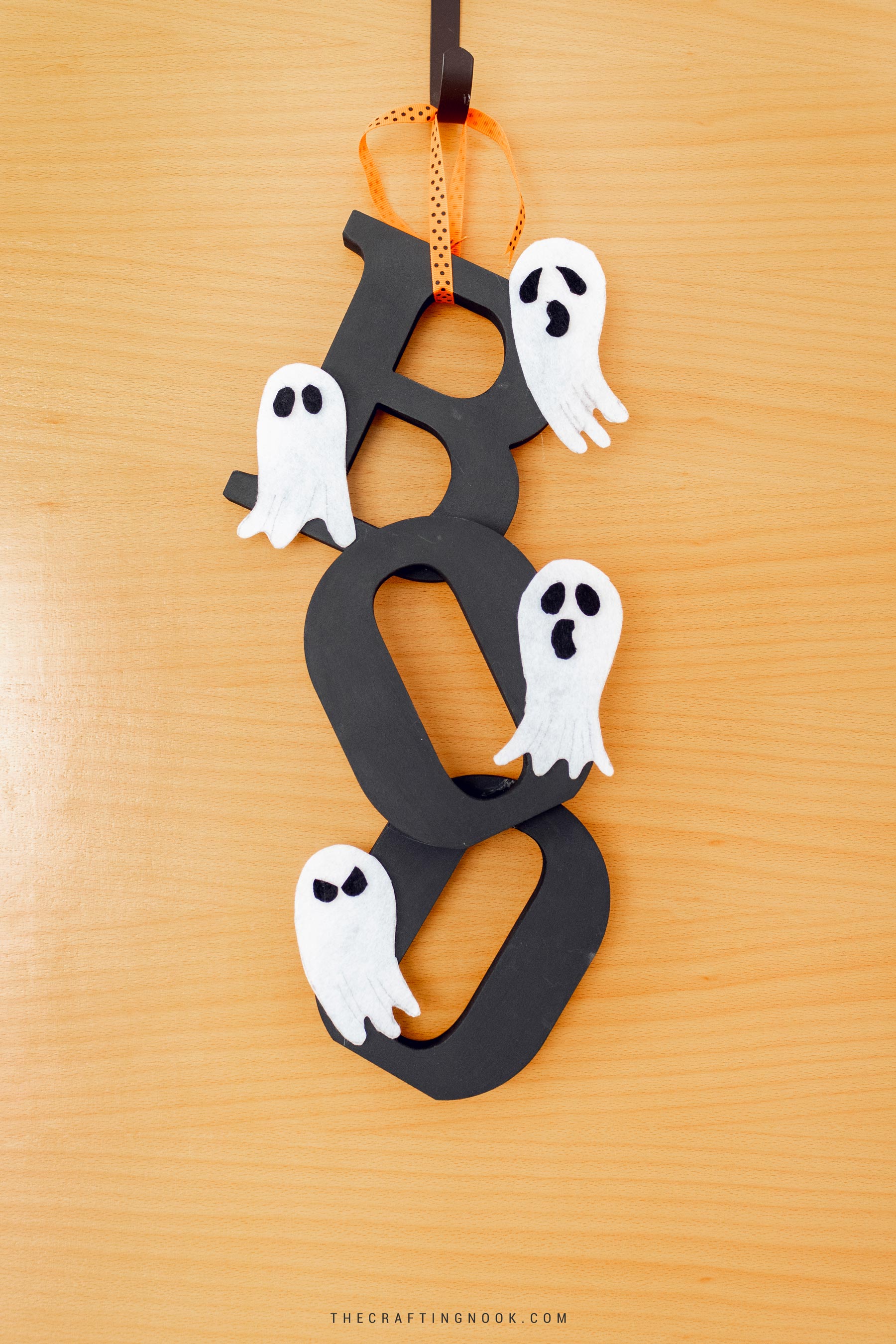 DIY Halloween Door Hanger hanging on the door. Feature image