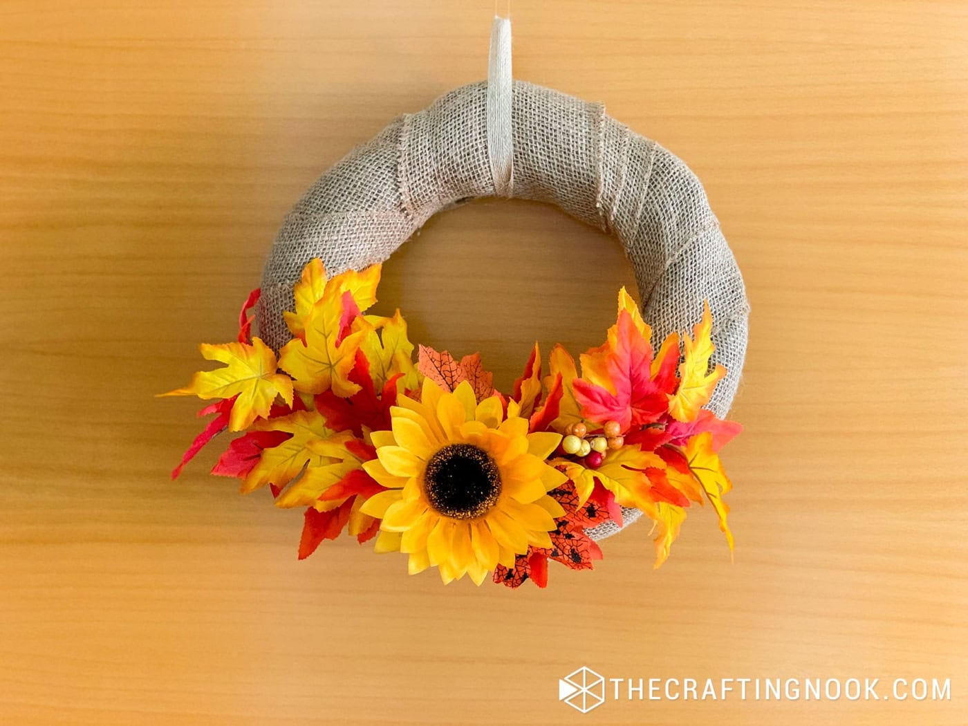 DIY Burlap Wreath for Fall finished and hanging on the door