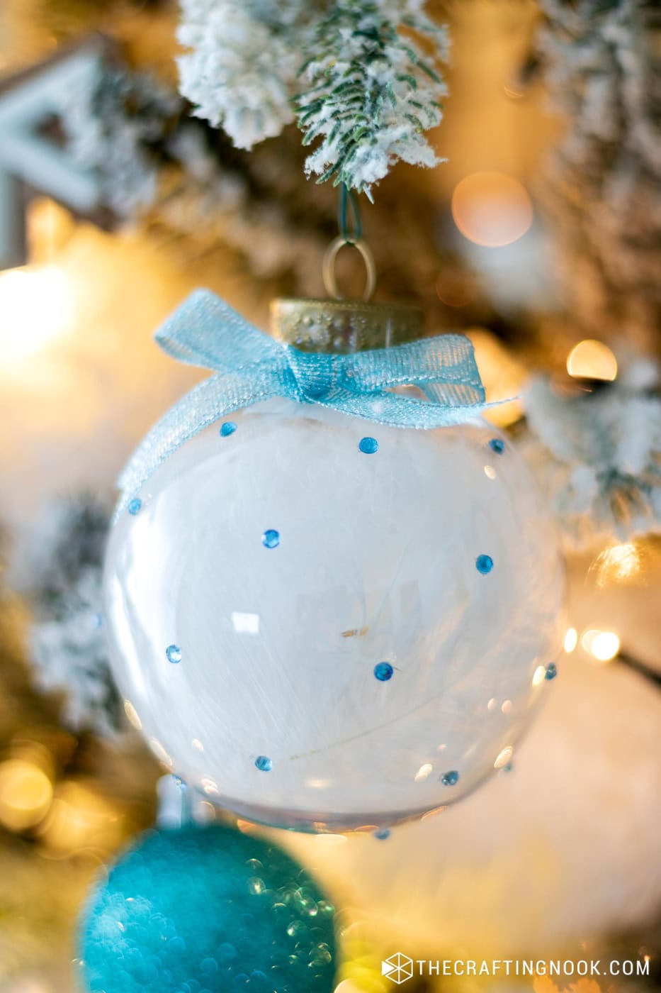 Closeup of the Cute Rhinestone Christmas Ornaments filled with feathers hanging on the tree