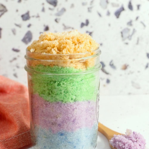 DIY Easy Sugar Scrub for Easter and Spring. layers of sugar scrub in different pastel colors, blue, purple, green and yellow. Cover image.