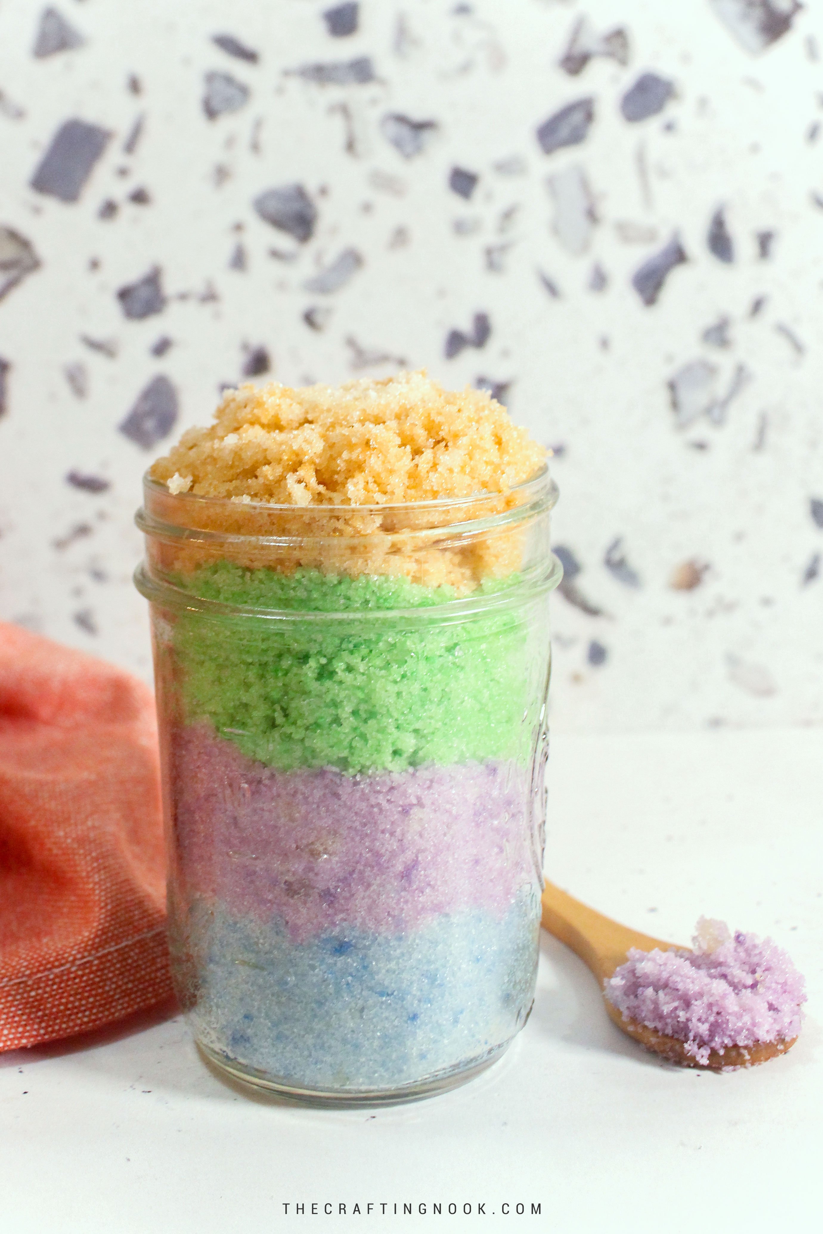 DIY Easy Sugar Scrub for Easter and Spring. layers of sugar scrub in different pastel colors, blue, purple, green and yellow. Cover image.