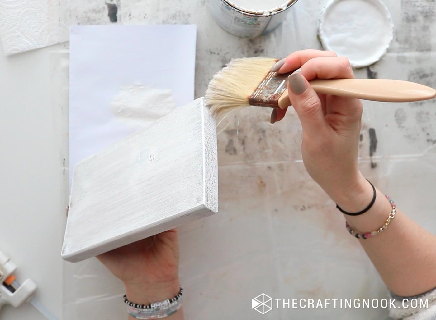 Painting the edges of the block with a dry-brush technique.