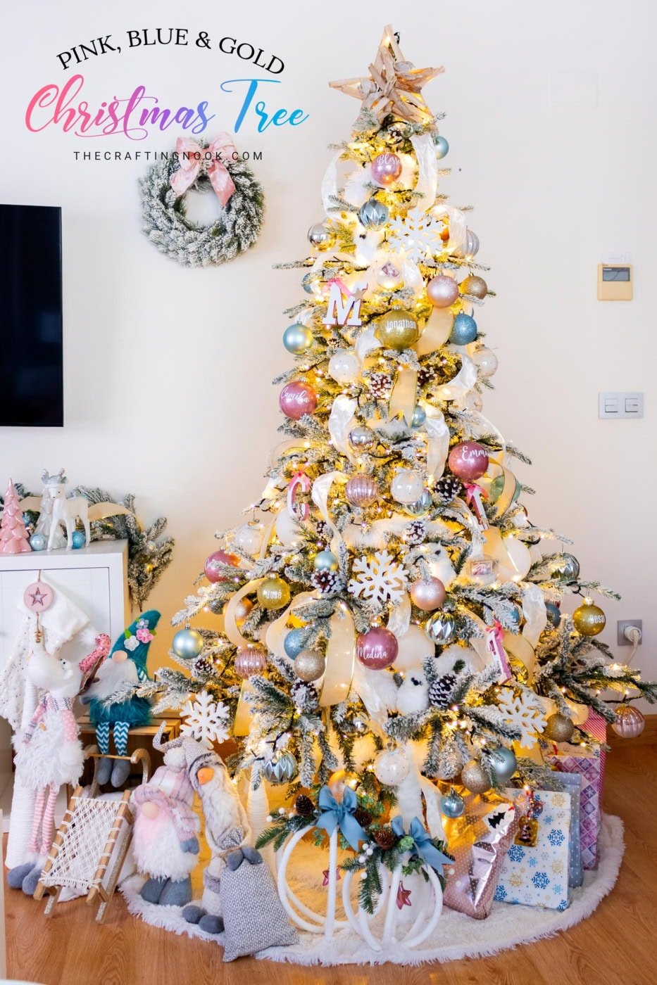 Flocked Christmas tree with pink, blue and gold ornaments, ribbon accents and handmade glitter baubles. Feature image with title overlay