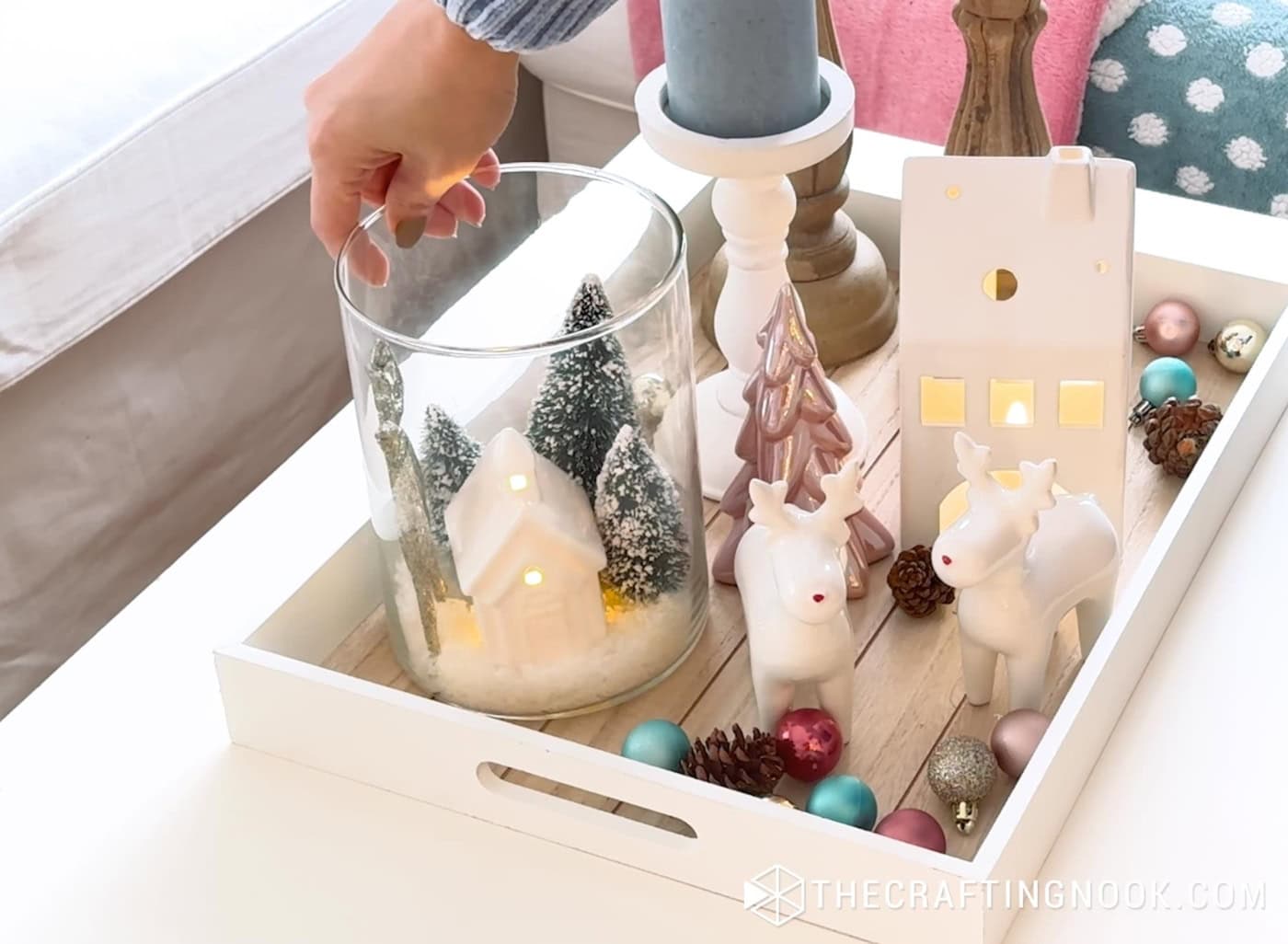 Decorative deer figurine placed beside the house inside the snowy jar village.
