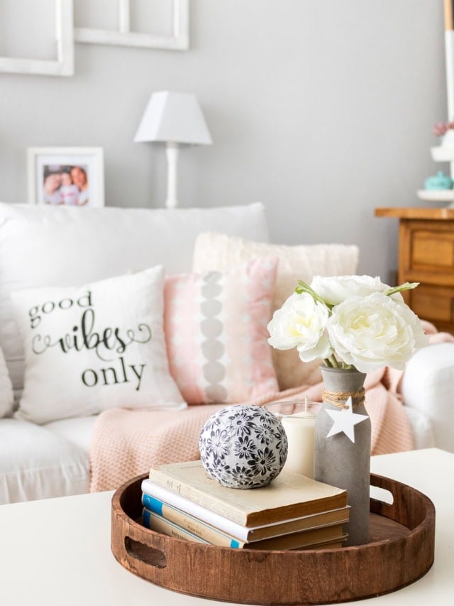 Beautiful living room with soft pastel accents and fresh flowers for seasonal decor.